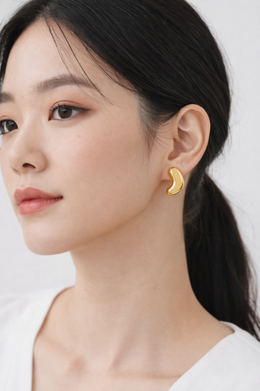 Boucle d'oreille difforme